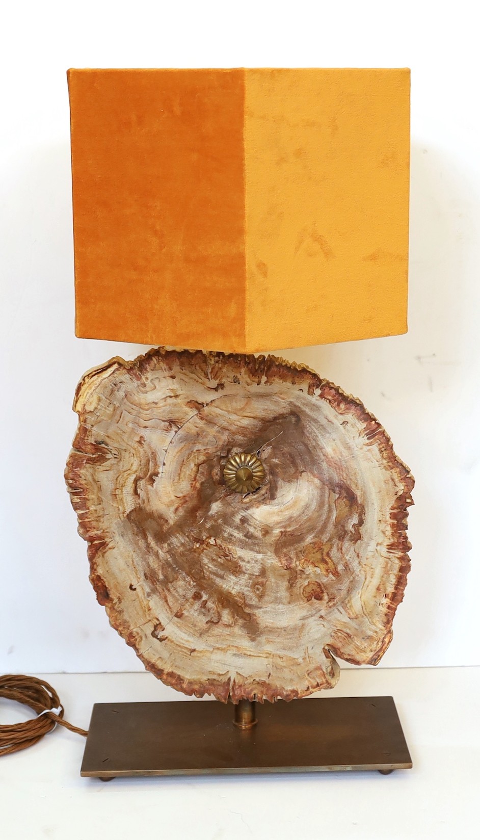 A bronze and petrified wood table lamp, height 60cm. width 28cm